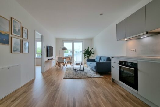 Neubauwohnung + 6,82 m² Balkon, Fußbodenheizung/-kühlung & optionaler TG-Wallbox – ab 02/2026 Wohnküche