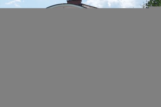 Traumhafte Villa in Bestlage der Veldener Bucht mit atemberaubendem Wörtherseeblick Rückseite / Terrasse und Balkon / Garten